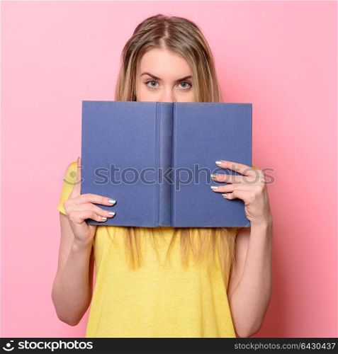 Woman having fun on study process and reading a book.
