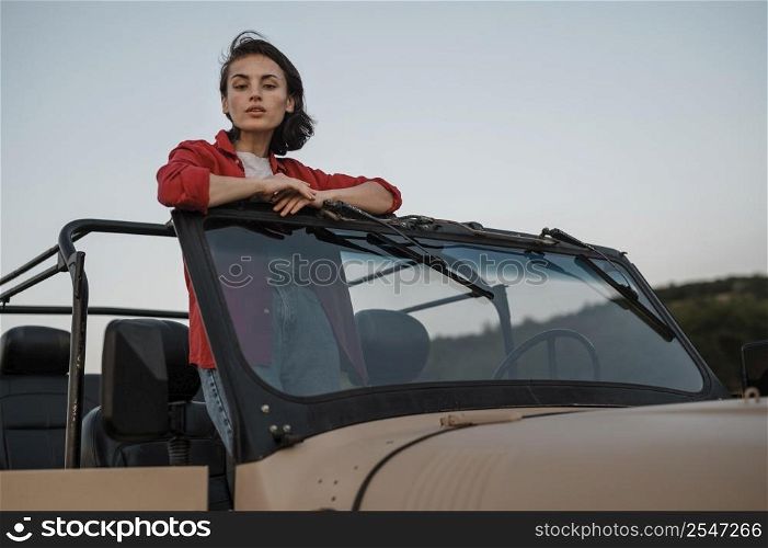 woman having fun traveling alone by car