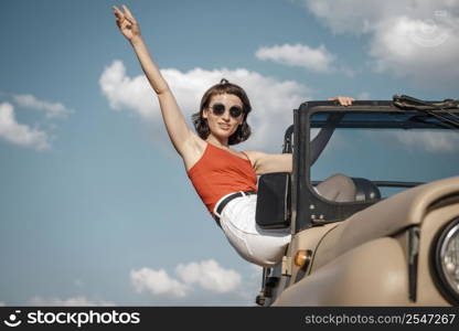 woman having fun traveling by car