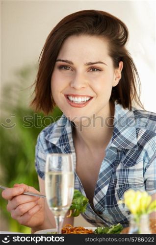 Woman Having Meal In Cafe