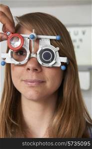 Woman Having Sight Test At Optometrist