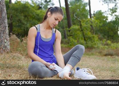 woman having sprain while running