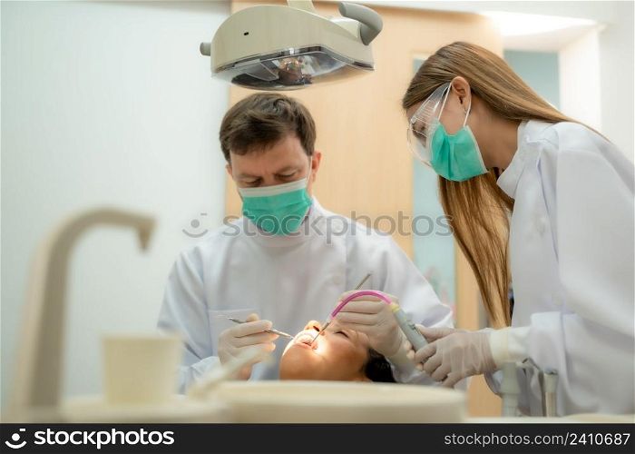 Woman having teeth examined at dentists,Overview of dental caries prevention,Medicine,Stomatology and health care concept.