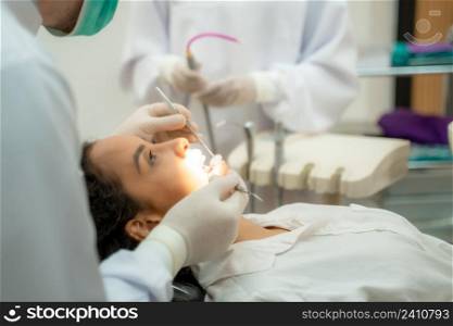 Woman having teeth examined at dentists,Overview of dental caries prevention,Medicine,Stomatology and health care concept.