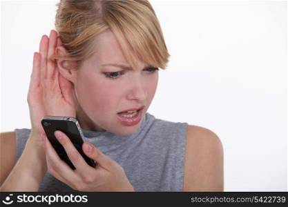 Woman having troubles hearing.