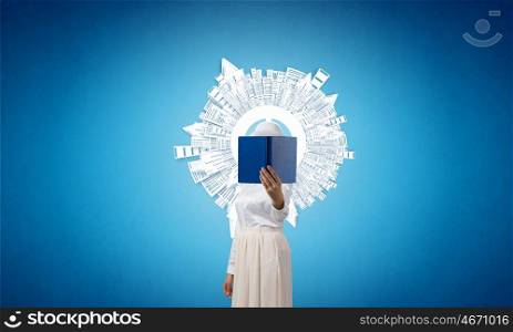 Woman hiding face behind book. Woman with opened book against her face