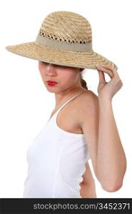 Woman hiding her face under a wide-brimmed hat