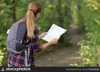 woman hiker attractive adventure wilderness holding map