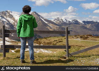 woman hiker in the Pyrenees mountains in spring with snow