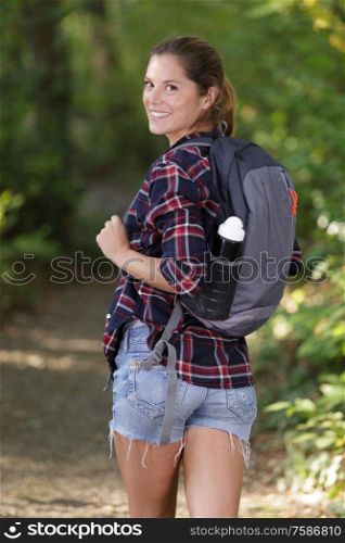 woman hiker looking back at the camera