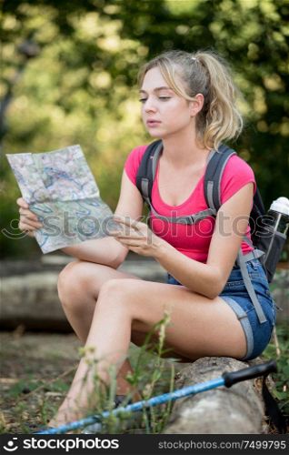 woman hiker looks the map