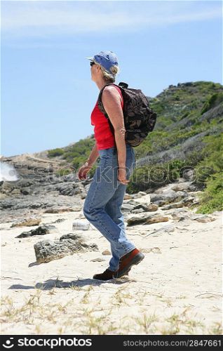 Woman hiking along the coast