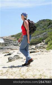Woman hiking along the coast