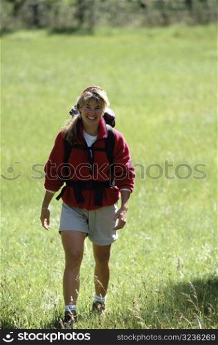 Woman Hiking and Smiling