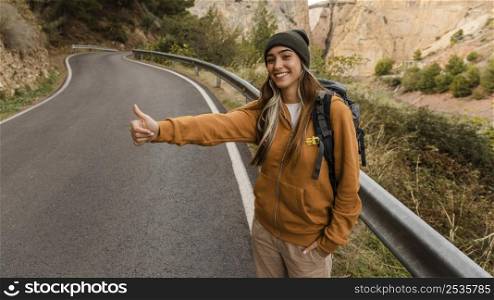 woman hitch hiking car