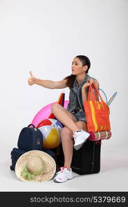 Woman hitchhiking to the beach