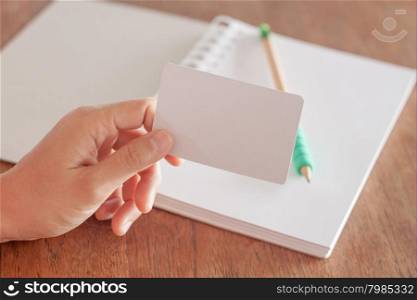 Woman hold blank business cards, stock photo