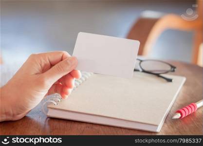 Woman hold blank business cards, stock photo