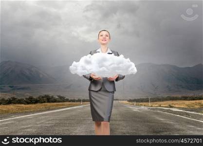 Woman hold cloud. Attractive businesswoman holding cloud as computing concept