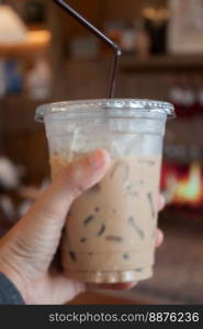 Woman hold her iced coffee, stock photo