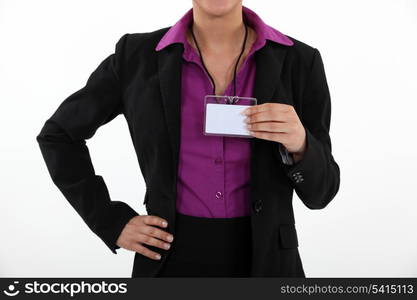 Woman holding a blank name tag