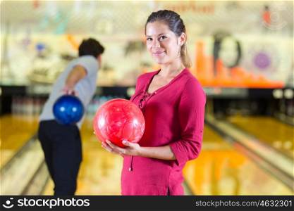 woman holding a bowling ball