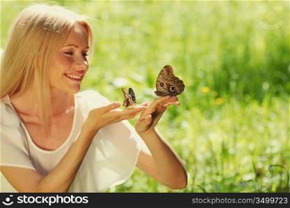 Woman holding a butterfly