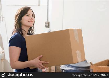 Woman holding a cardboard box