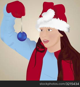 Woman holding a Christmas decoration