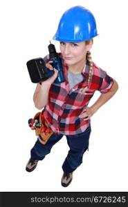 Woman holding a cordless drill