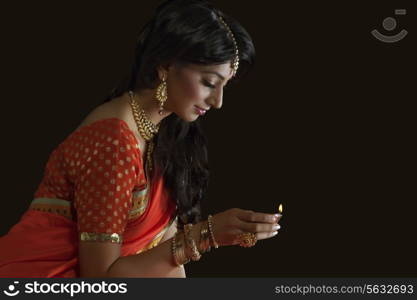 Woman holding a diya