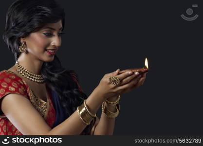 Woman holding a diya