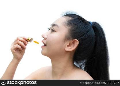 Woman holding a dropper sublingual Cannabis oil at white background