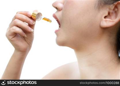 Woman holding a dropper sublingual Cannabis oil at white background