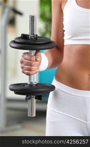 Woman holding a dumbbell