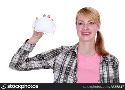Woman holding a face mask