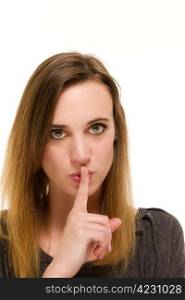 woman holding a finger to her mouth to shh. woman holding a finger to her mouth to shh on white background