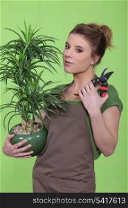 Woman holding a flowerpot