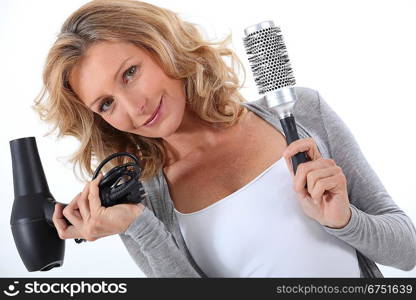 Woman holding a hair dryer