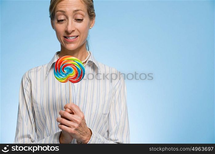 Woman holding a lollipop