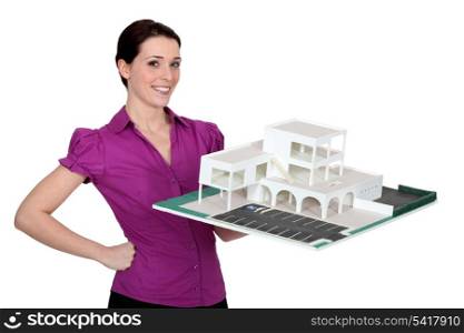 woman holding a model building