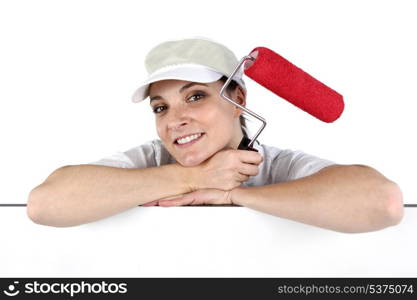 Woman holding a paint roller