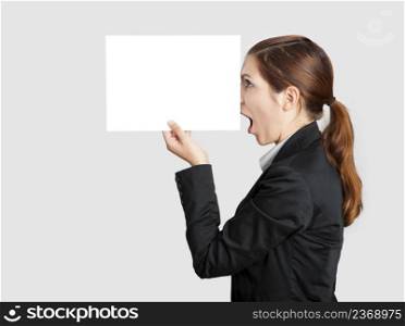 Woman holding a  paper sheet with a sketch of pinnochio nose on it