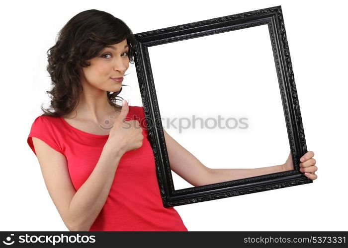 Woman holding a picture frame