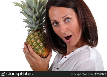 Woman holding a pineapple