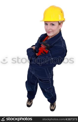 Woman holding a pipe wrench