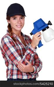 Woman holding a spray gun