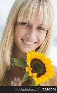 Woman holding a sunflower
