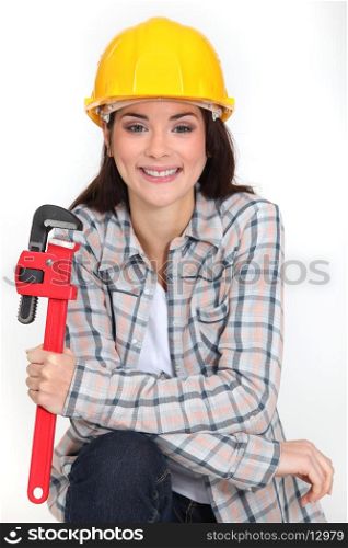 Woman holding adjustable wrench