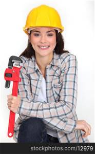 Woman holding adjustable wrench